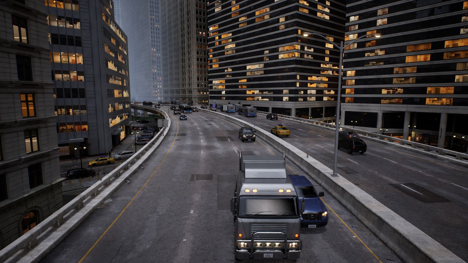 A truck on an elevated freeway in the rain